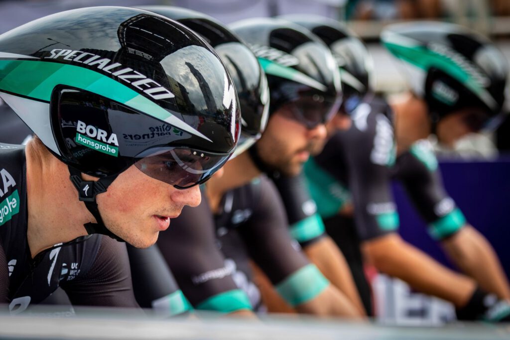 Team of track cyclists riding in tight formation