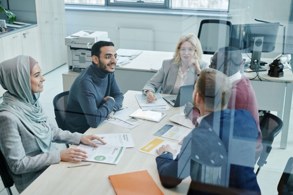 Team meeting around a conference table in a bright office
